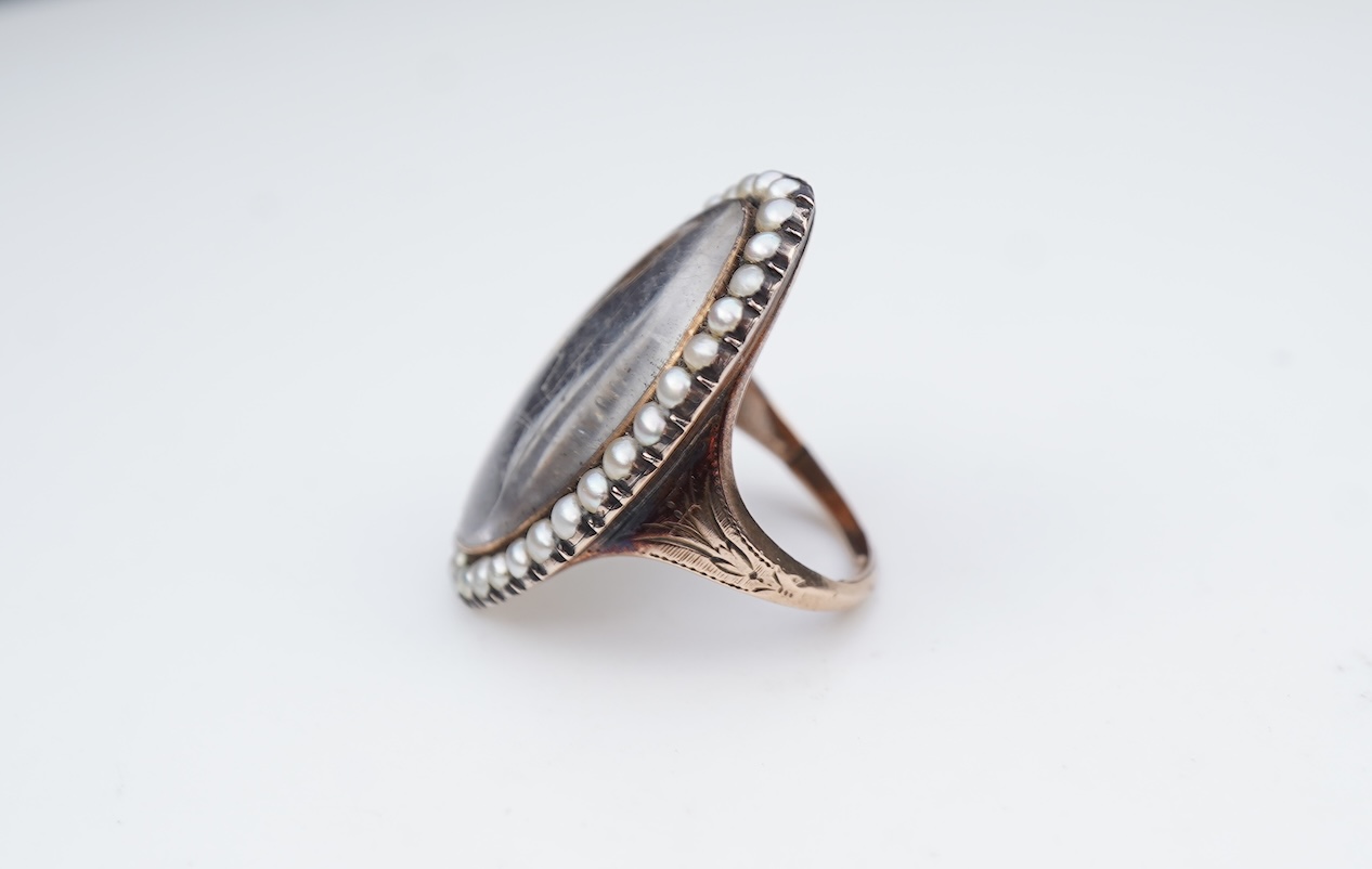 A fine George III seed pearl, enamel and diamond mourning ring, circa 1782